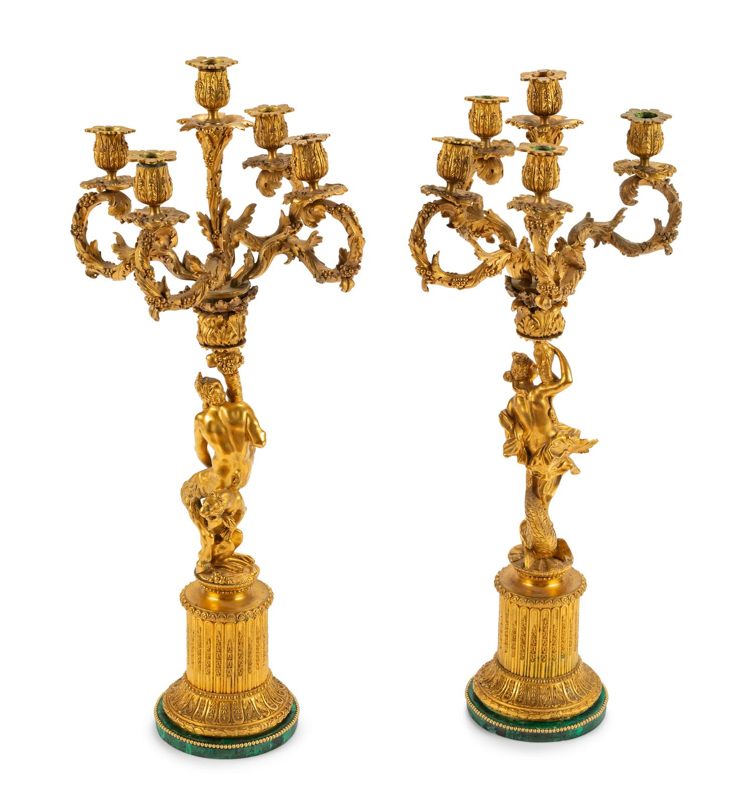 A Pair of Continental Gilt Bronze Figural Five-Light Candelabra with Malachite Veneered Bases