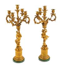 A Pair of Continental Gilt Bronze Figural Five-Light Candelabra with Malachite Veneered Bases