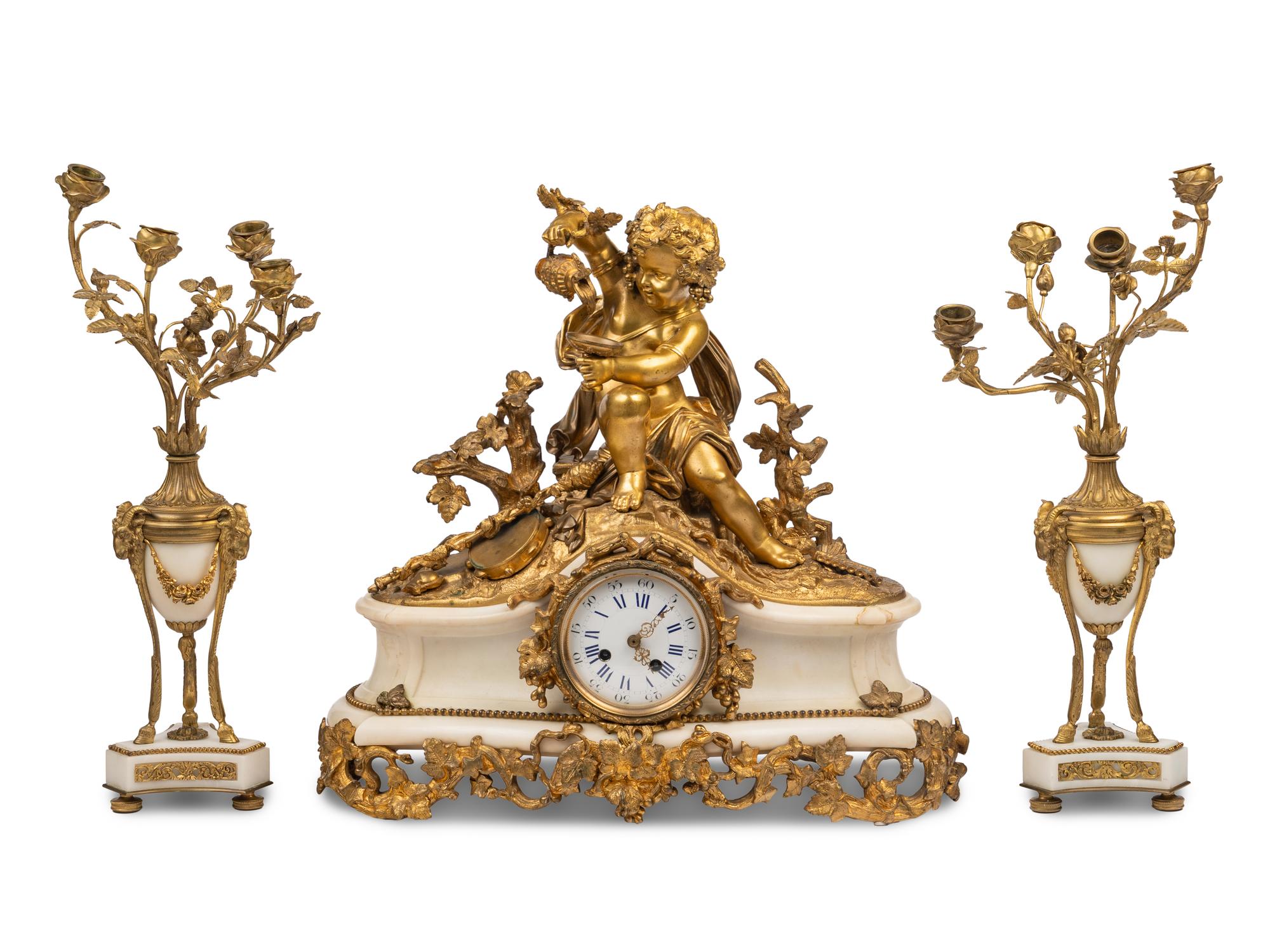 An Assembled French Gilt Bronze Mounted Marble Three-Piece Clock Garniture