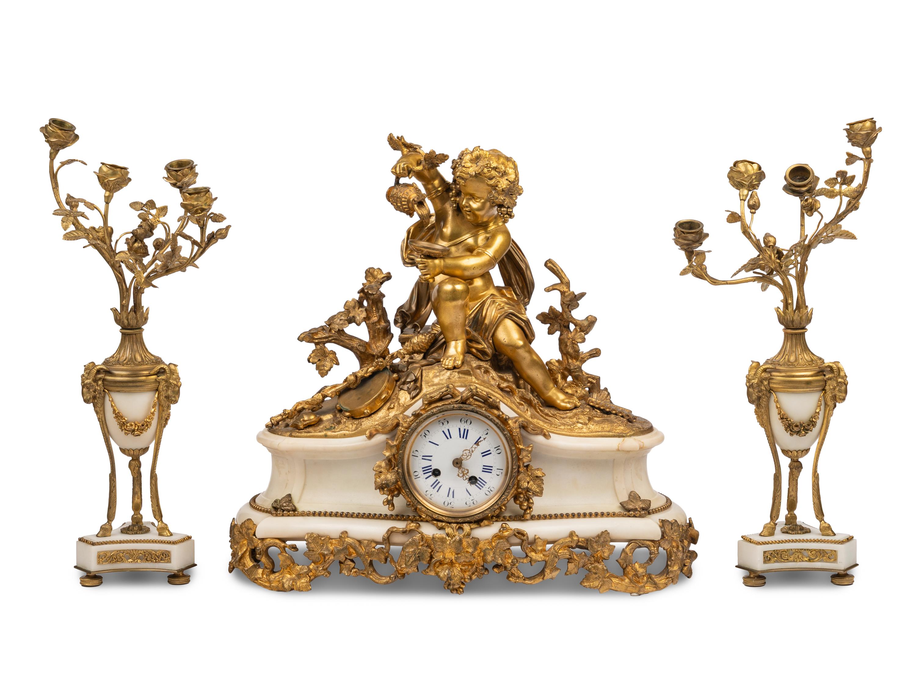 An Assembled French Gilt Bronze Mounted Marble Three-Piece Clock Garniture