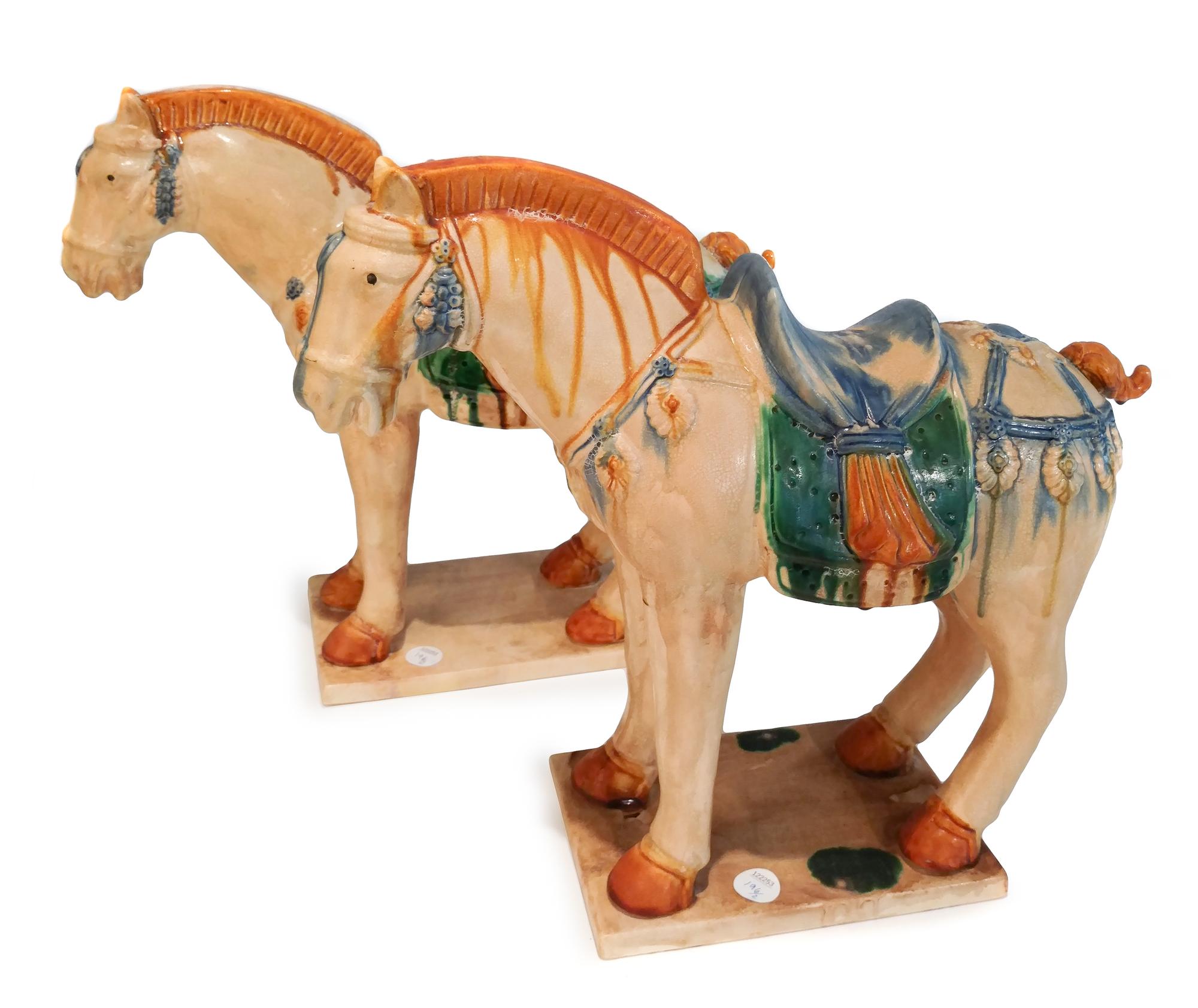 A Pair of Tang Style Partially Glazed Ceramic Horses