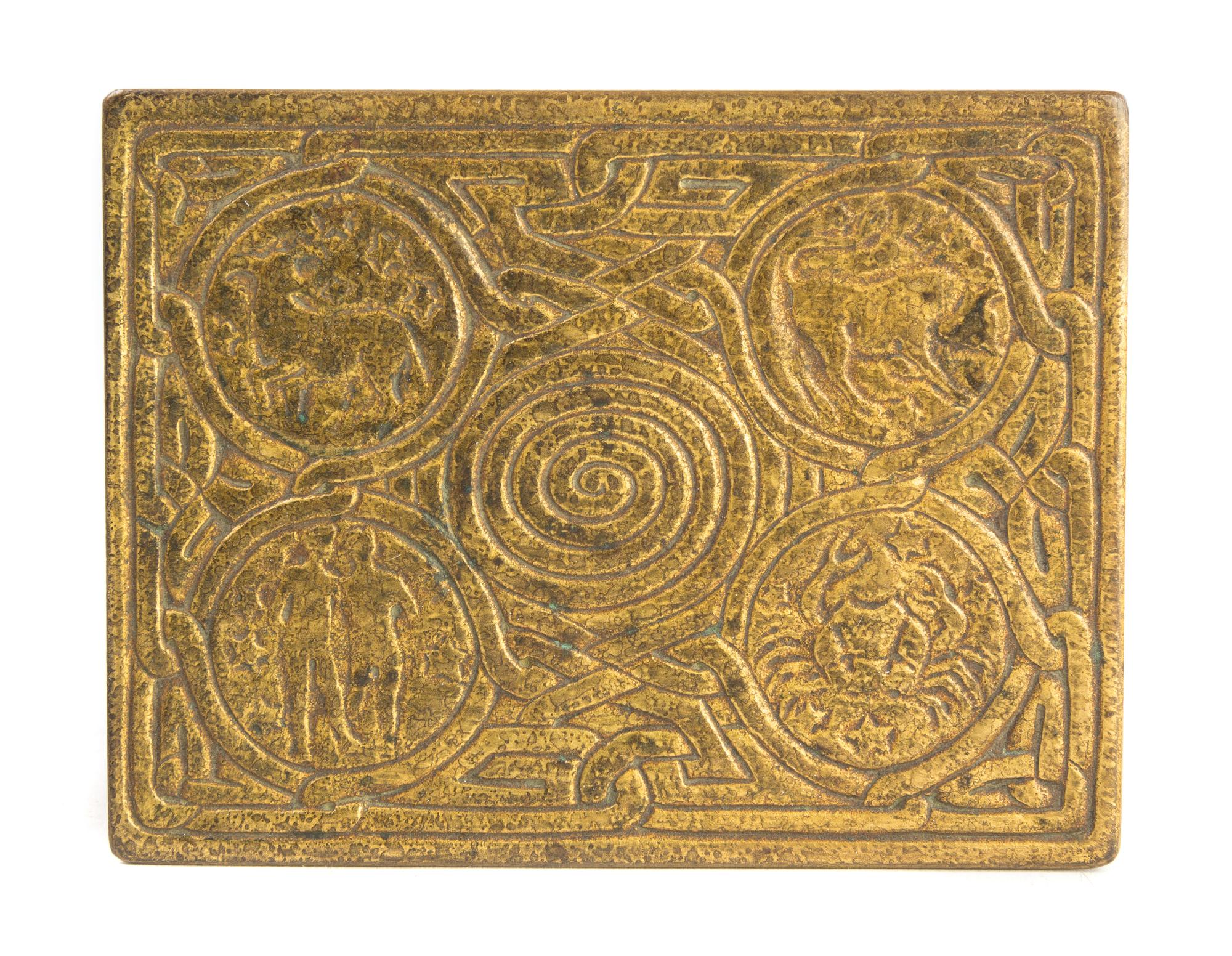 Tiffany Studios, a Zodiac pattern bronze dore nine-piece desk set