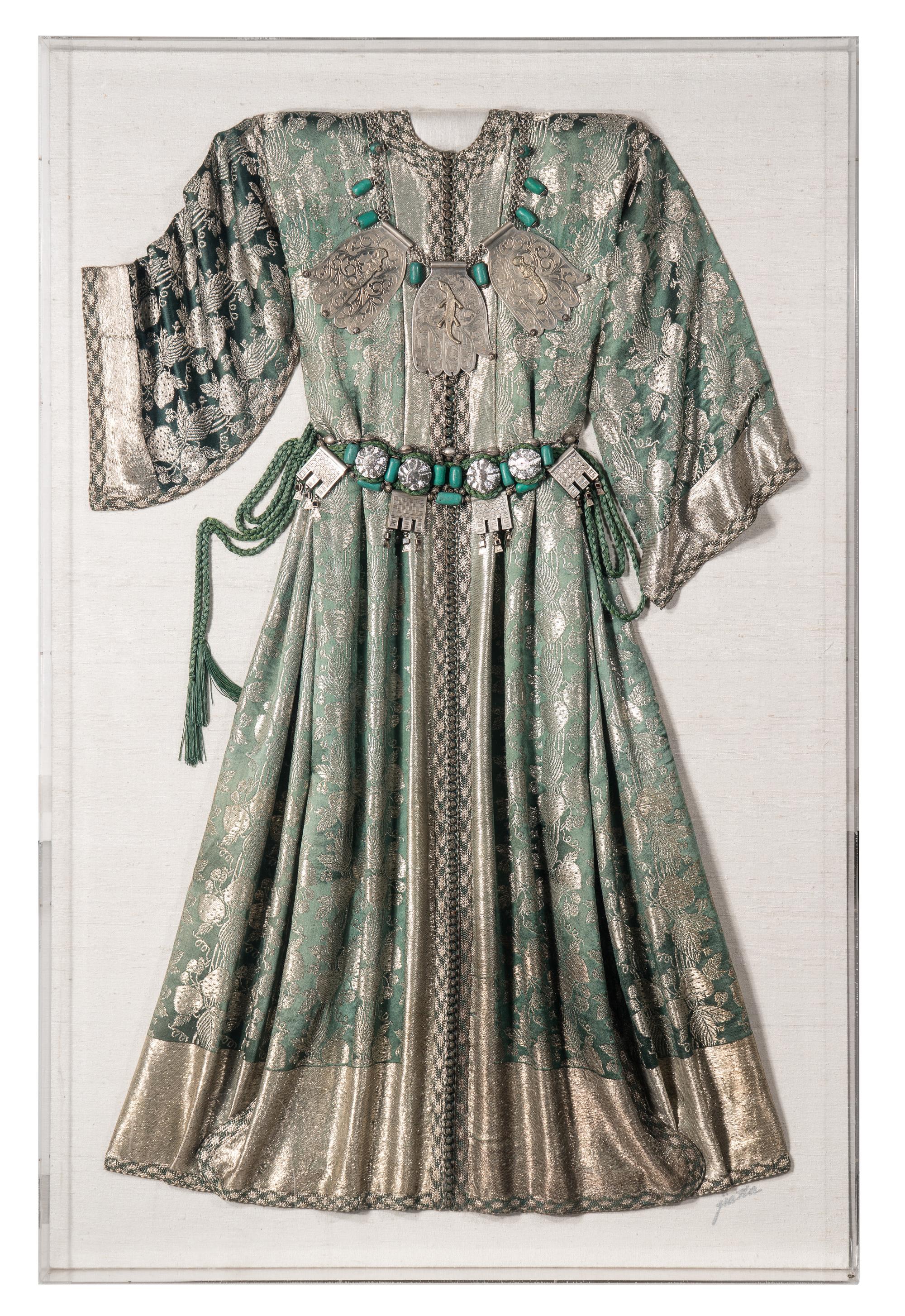 A Middle Eastern Metal and Stone-Embellished Dress in an Acrylic Frame