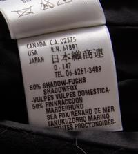 An Escada Black Wool Fox Trim Coat, Size 36.