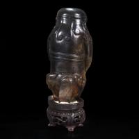An unusual Chinese dark brown-black jade carving of a Lohan 笑狮罗汉玉雕 Ming dynasty or earlier ????