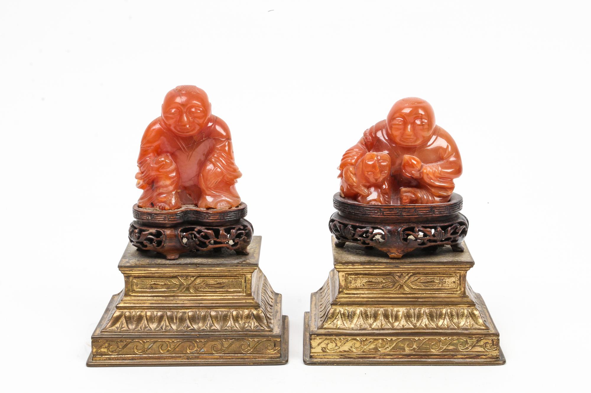 A Pair of Chinese Carved Carnelian Agate Figures Height overall 5 inches.