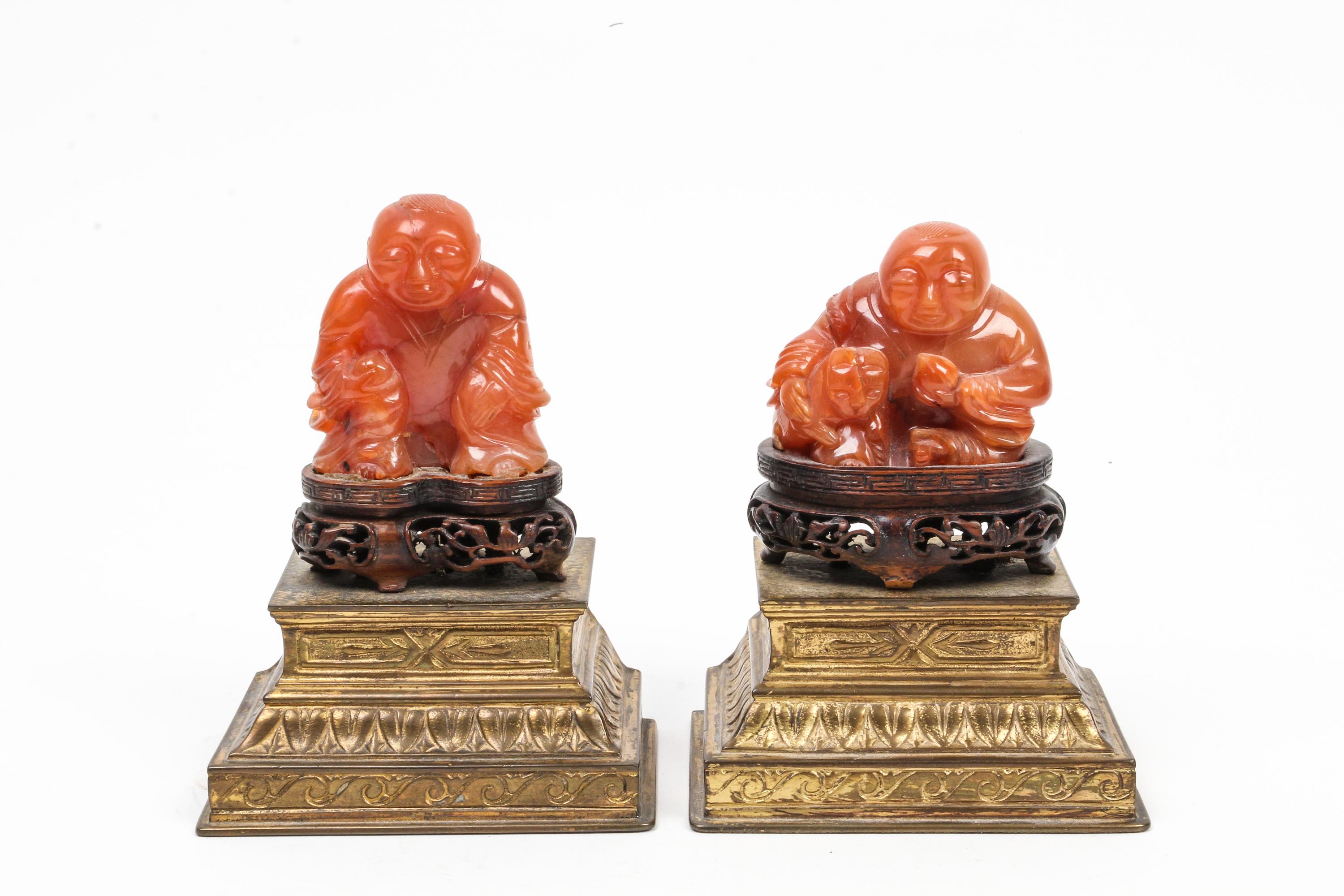 A Pair of Chinese Carved Carnelian Agate Figures Height overall 5 inches.