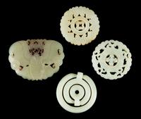 Four Celadon Jade Plaques Length of largest 3 1/8 inches.