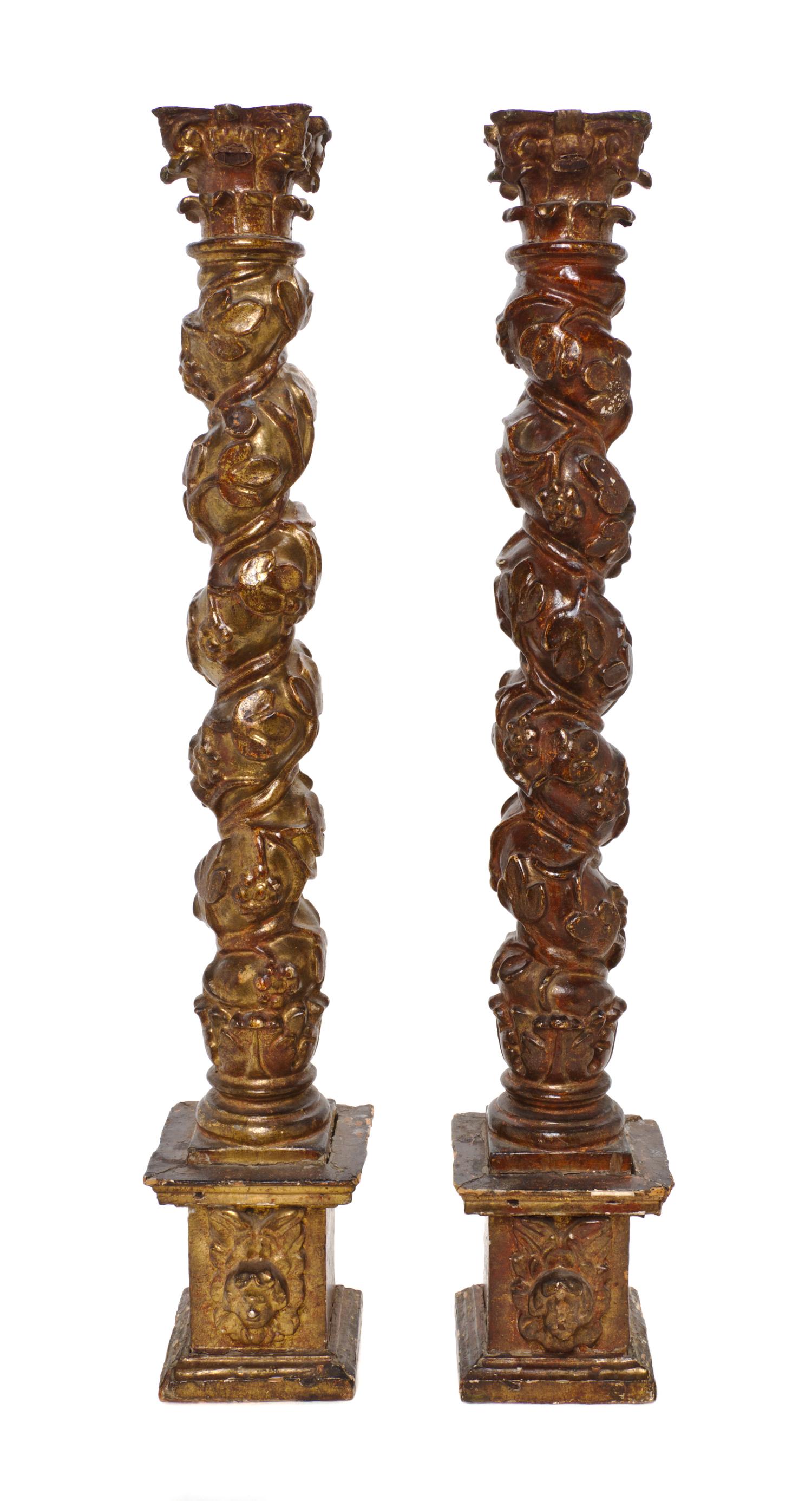 A Pair of Continental Painted and Gilt Solomonic Columns, Height 26 1/4 inches.