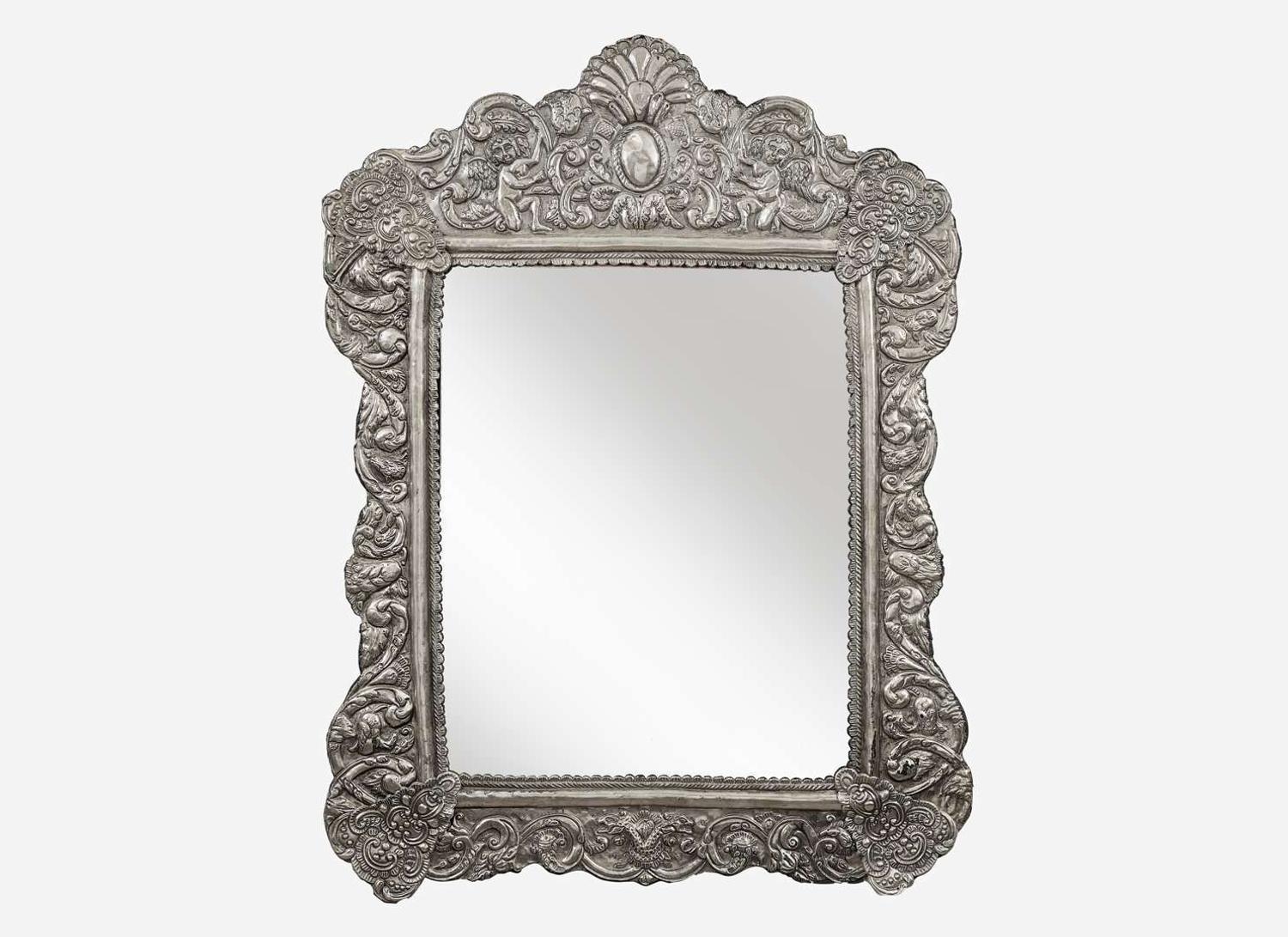 A Spanish Colonial style silver or silverplated repoussé mirror, 20th century