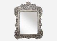 A Spanish Colonial style silver or silverplated repoussé mirror, 20th century