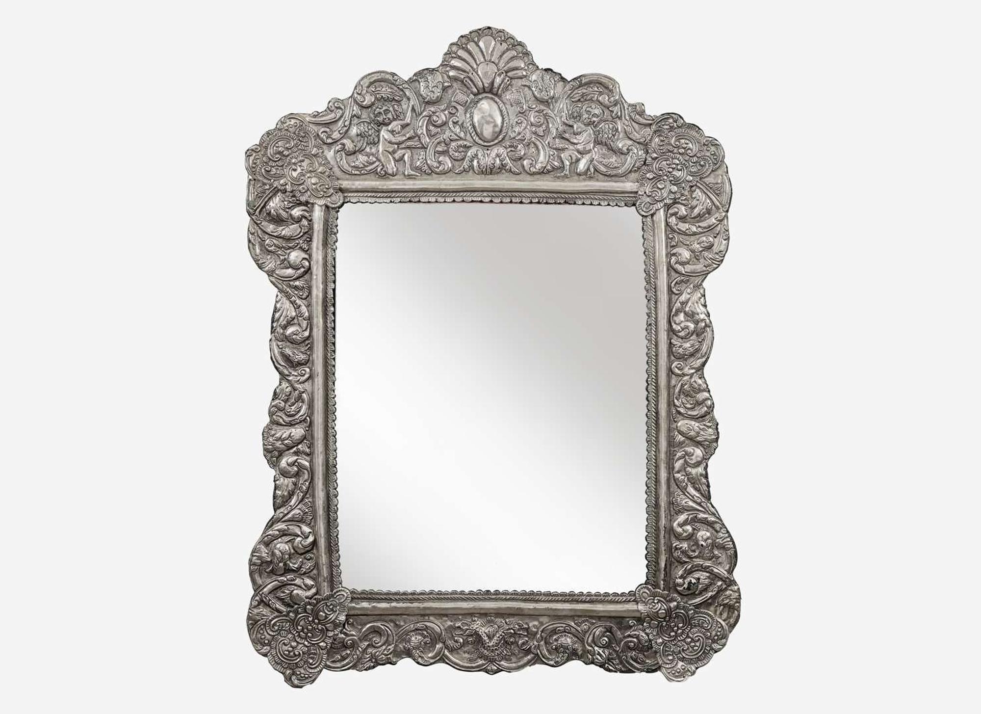 A Spanish Colonial style silver or silverplated repoussé mirror, 20th century