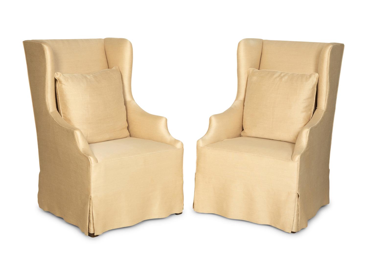 A Pair of Linen-Upholstered Wingback Slip Covered Chairs