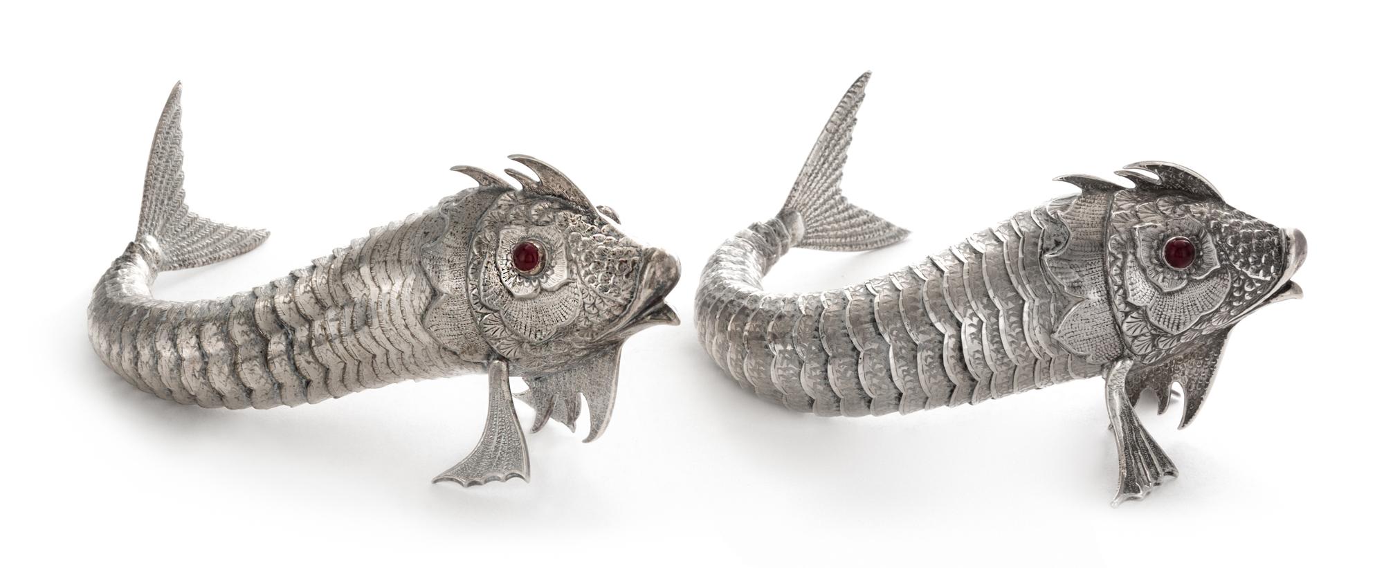 A Pair of Spanish Silver Models of Fish, Maker's Mark M.G., 20th Century, each having a fully articulated body with red-glass inset eye