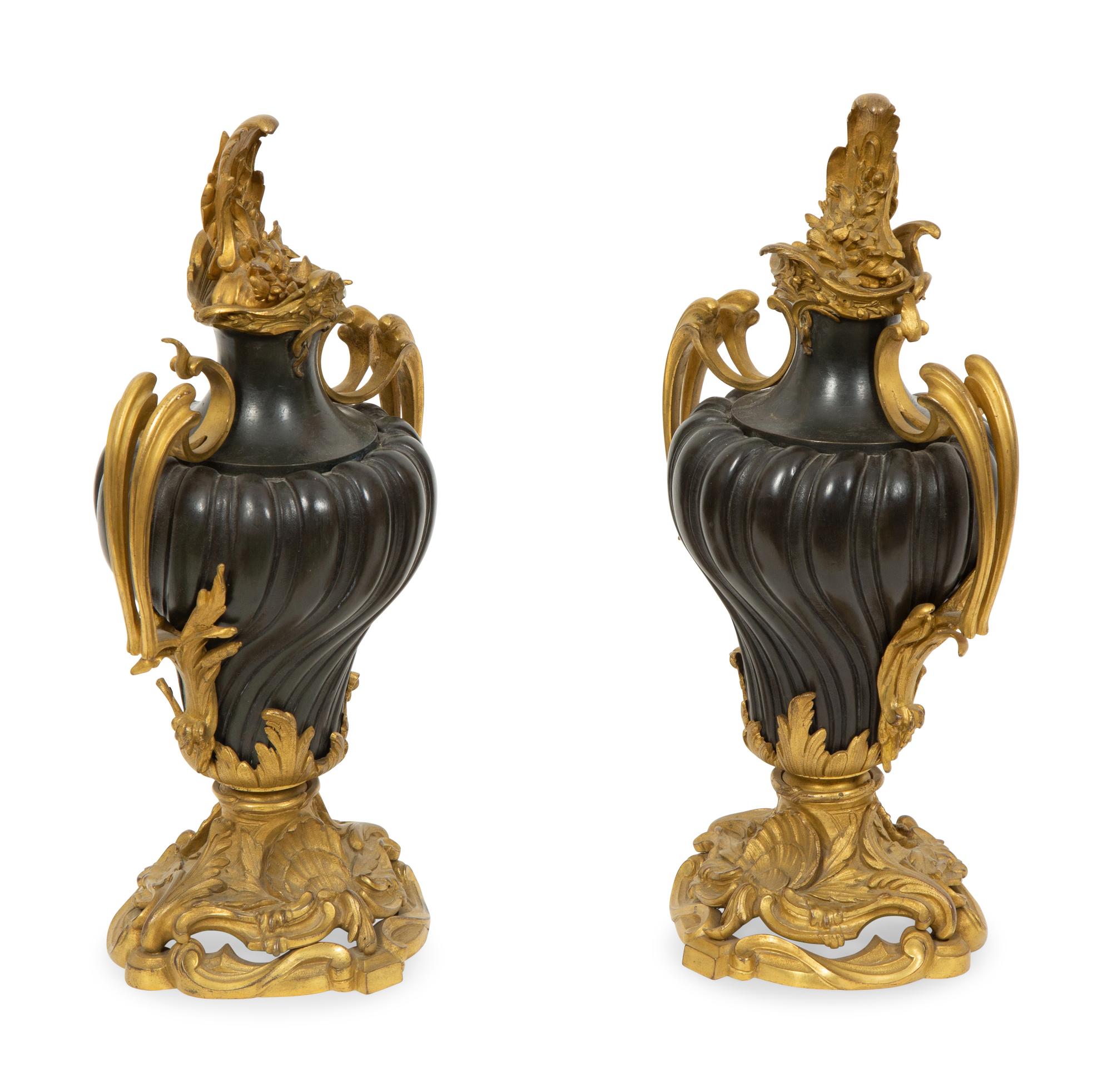 A Pair of French Gilt and Patinated Bronze Urns