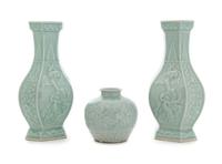 Three Carved Celadon Glazed Porcelain Vessels Height of tallest 11 1/8 inches.