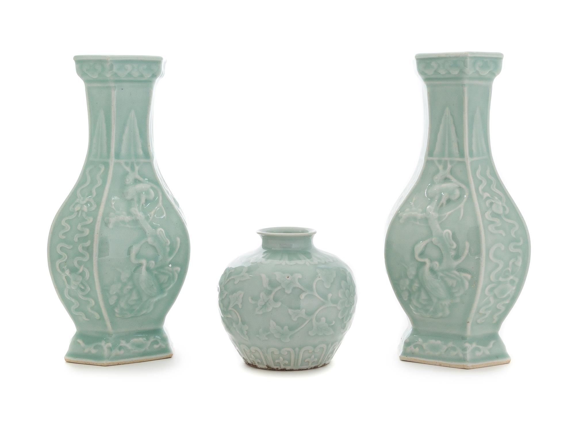 Three Carved Celadon Glazed Porcelain Vessels Height of tallest 11 1/8 inches.