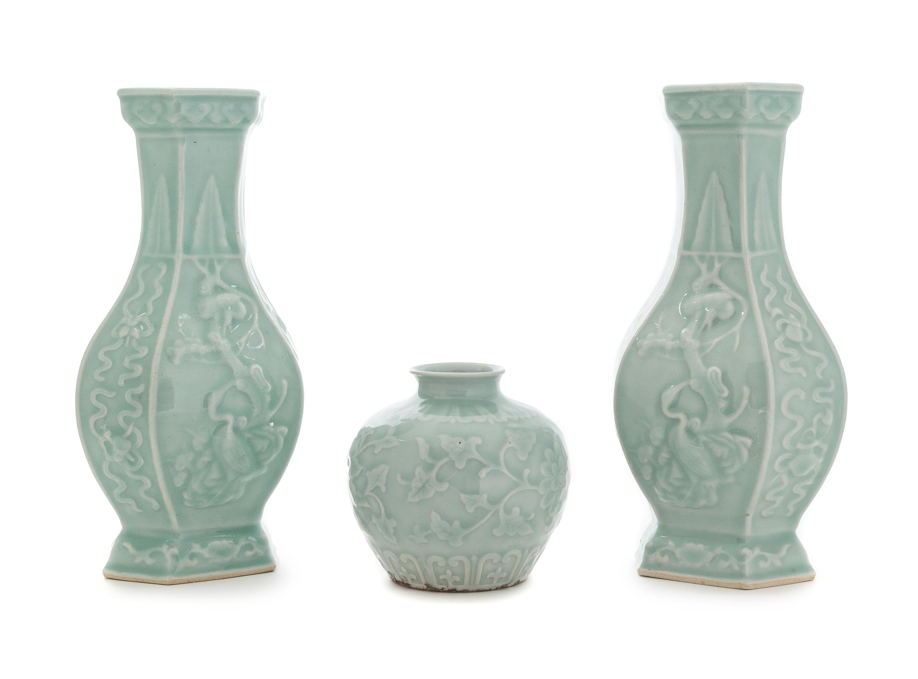 Three Carved Celadon Glazed Porcelain Vessels Height of tallest 11 1/8 inches.