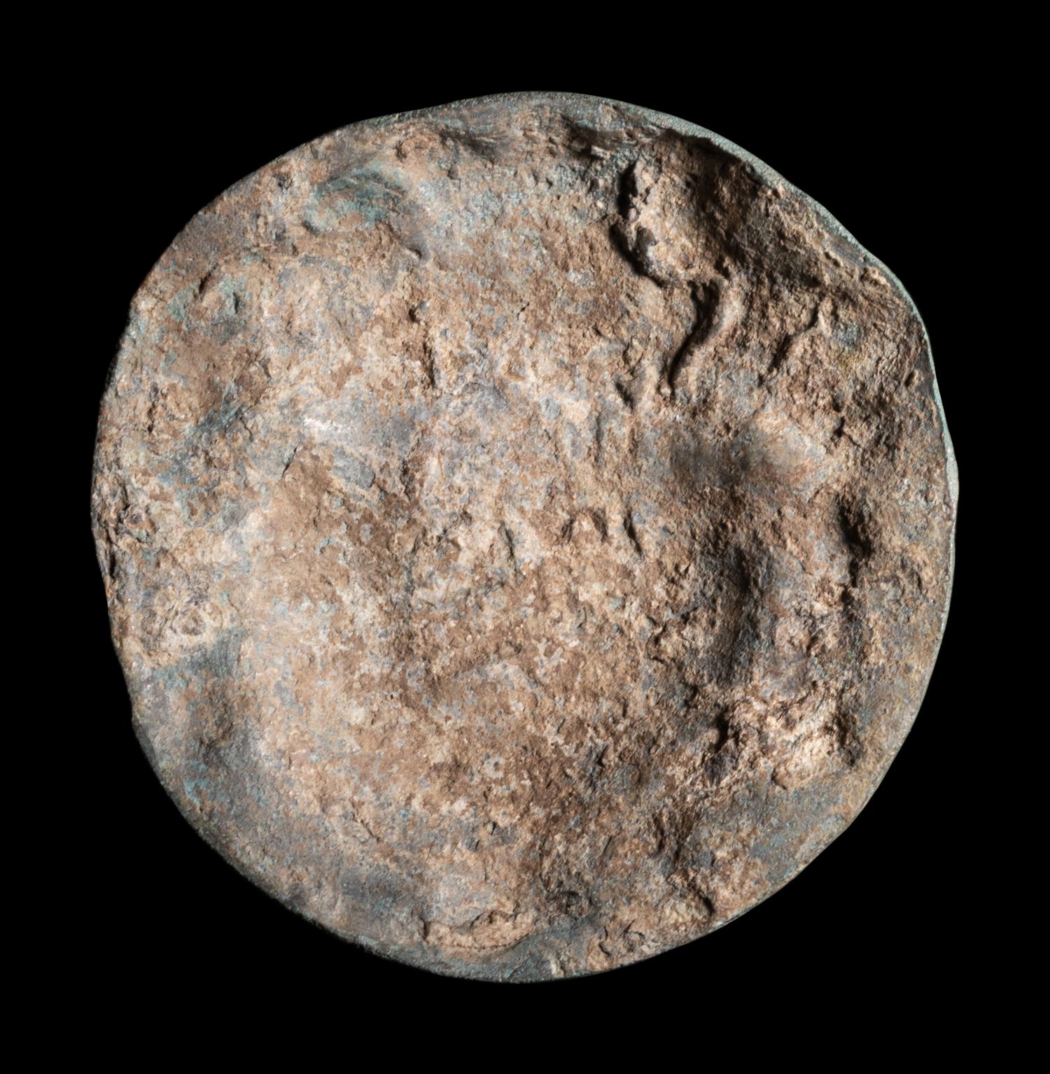 A Roman Bronze Roundel with Head of a Gorgon