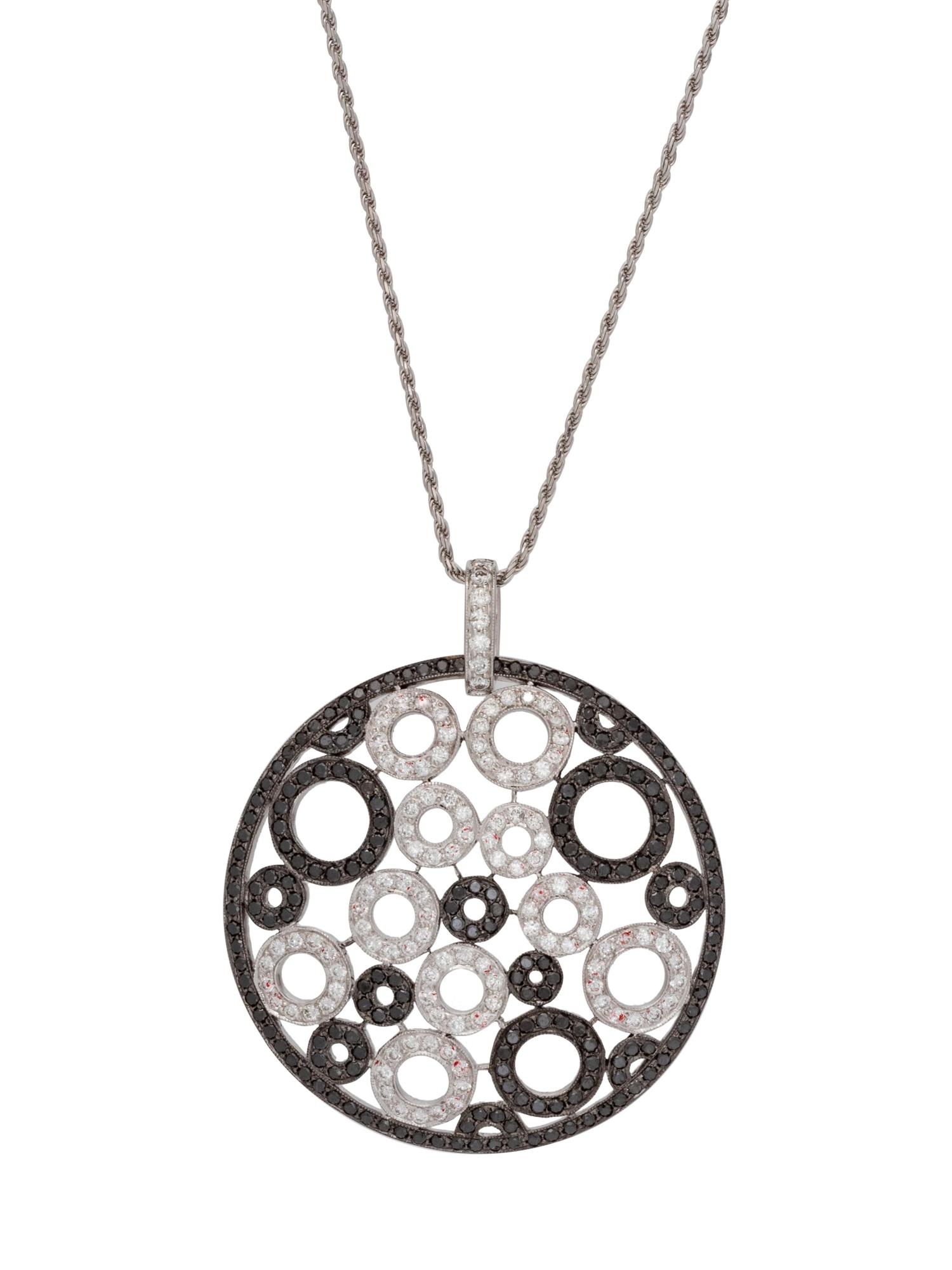 An 18 Karat White Gold, Black Diamond and Diamond Pendant/Necklace,