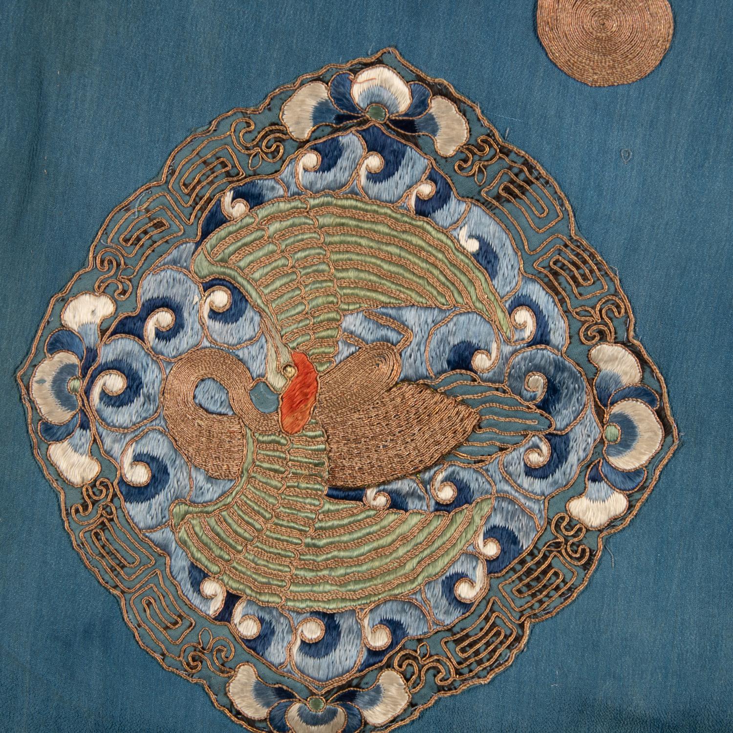 Two Chinese Blue Ground Silk Robes, Late Qing Dynasty 清晚期 藍地盤金繡游龍瑞獸纹道袍及藍地織錦女褂