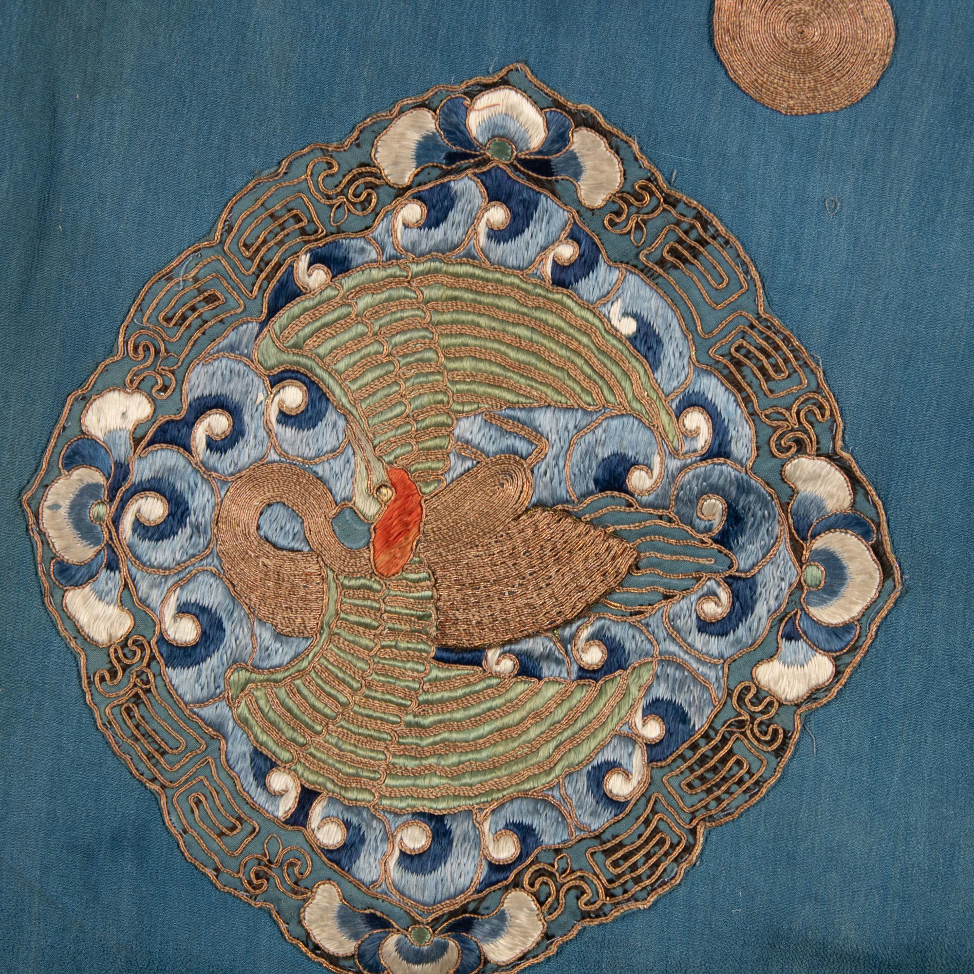 Two Chinese Blue Ground Silk Robes, Late Qing Dynasty 清晚期 藍地盤金繡游龍瑞獸纹道袍及藍地織錦女褂