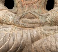 A Chinese Carved Stone Seated Guanyin Figure