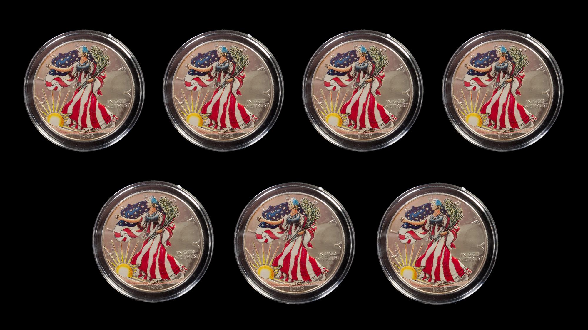 A Group of Seven United States Silver Eagle Colorized Dollar Coins