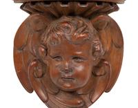 A Pair of English Carved Pear Wood Cherub Wall Brackets