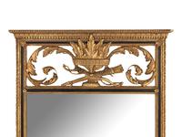 An Empire Style Parcel Ebonized Giltwood Mirror