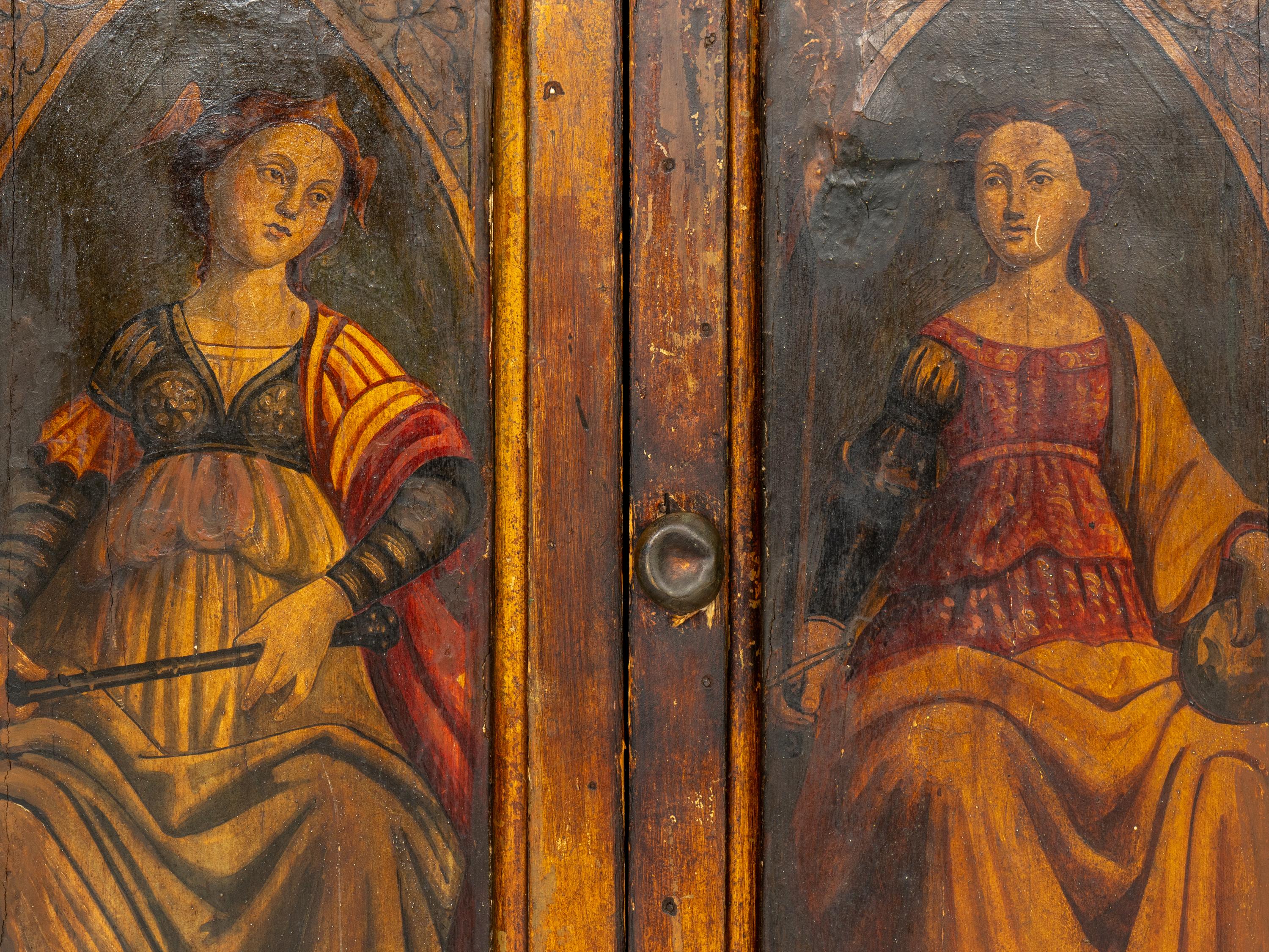 A Florentine Painted and Parcel Gilt Cabinet with Gesso Pastiglia Panels