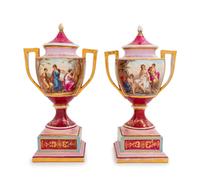 A Pair of Vienna Painted Porcelain Covered Urns and Stands