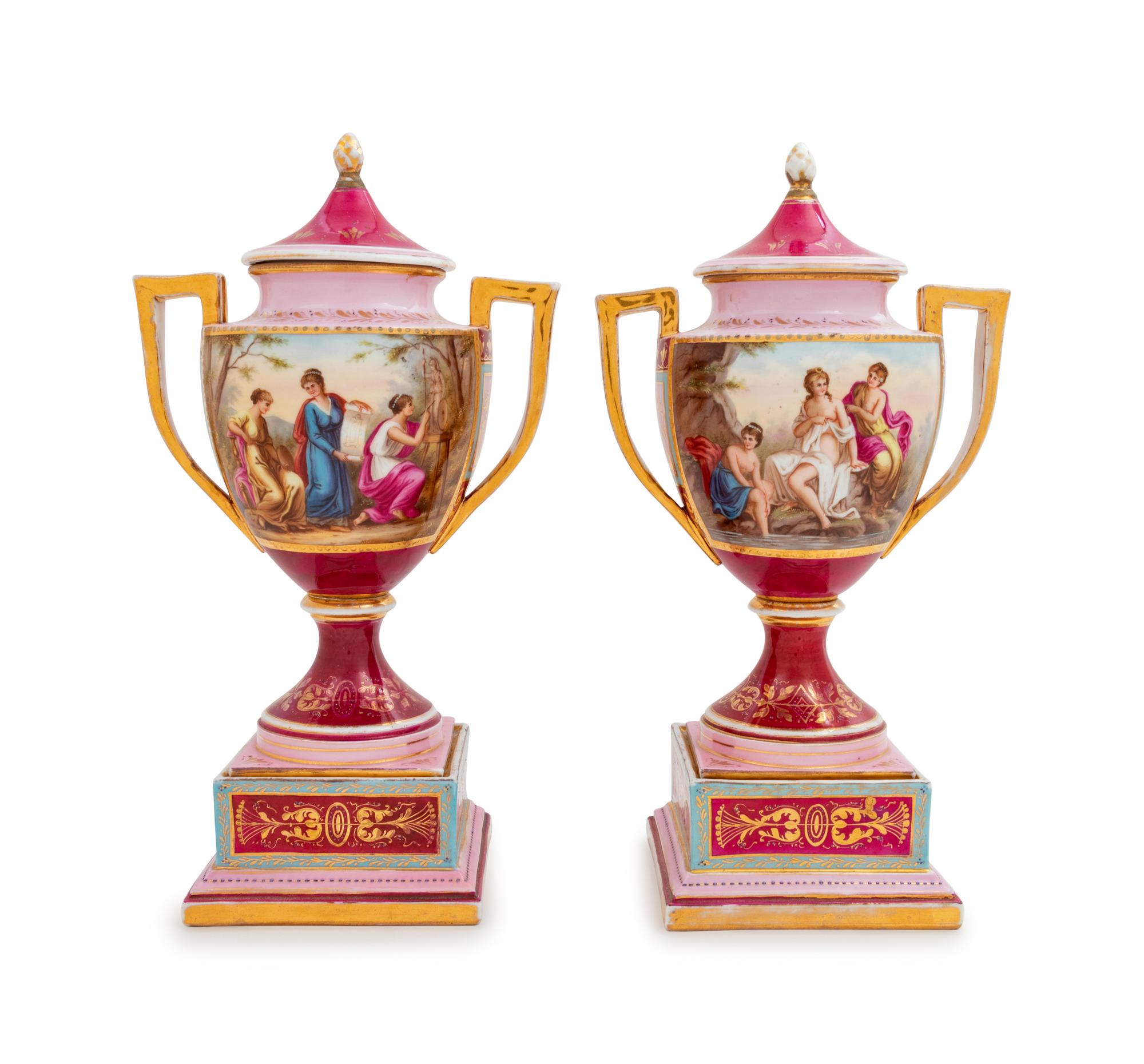 A Pair of Vienna Painted Porcelain Covered Urns and Stands