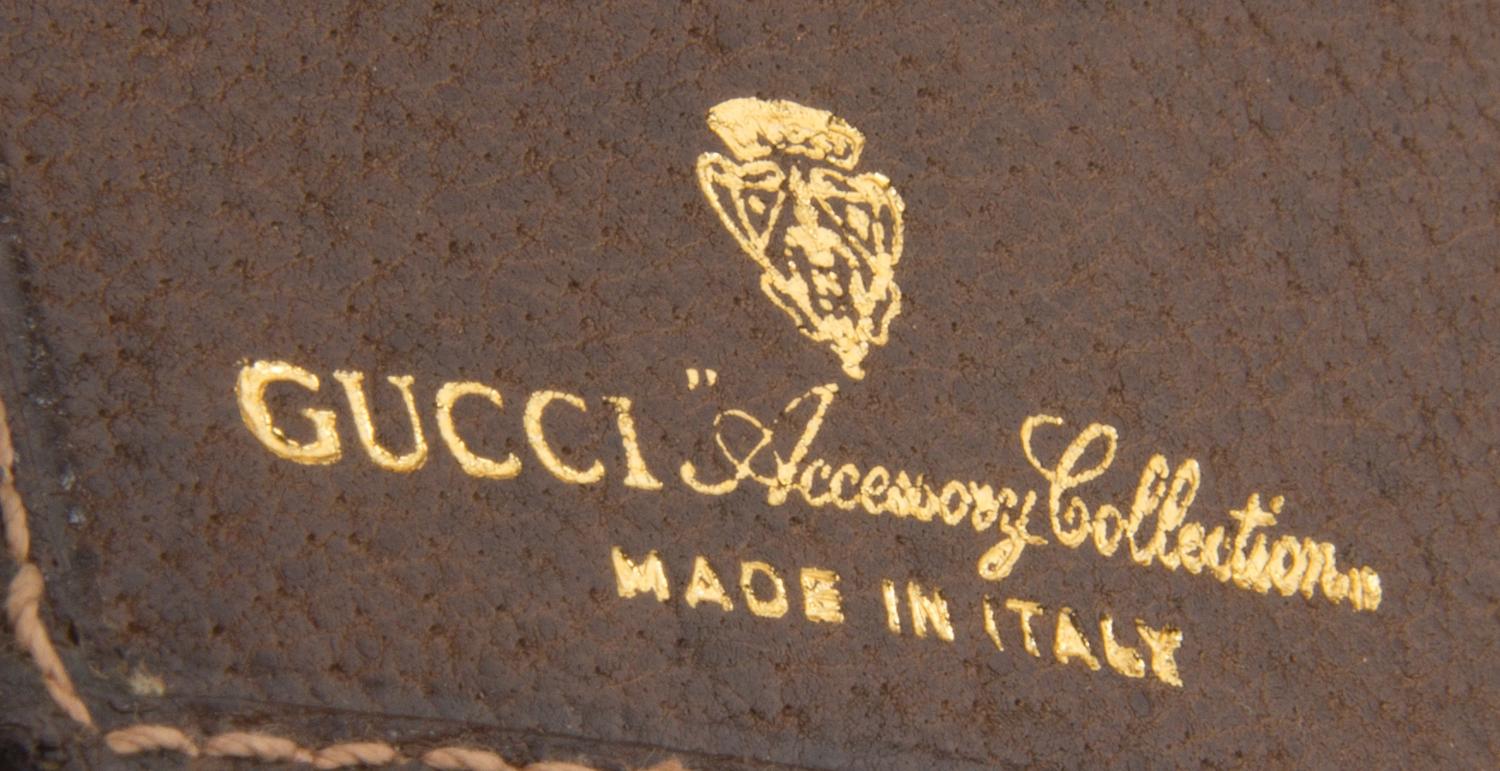 A Gucci Monogram Canvas Wallet, 7.5" x 4.5".