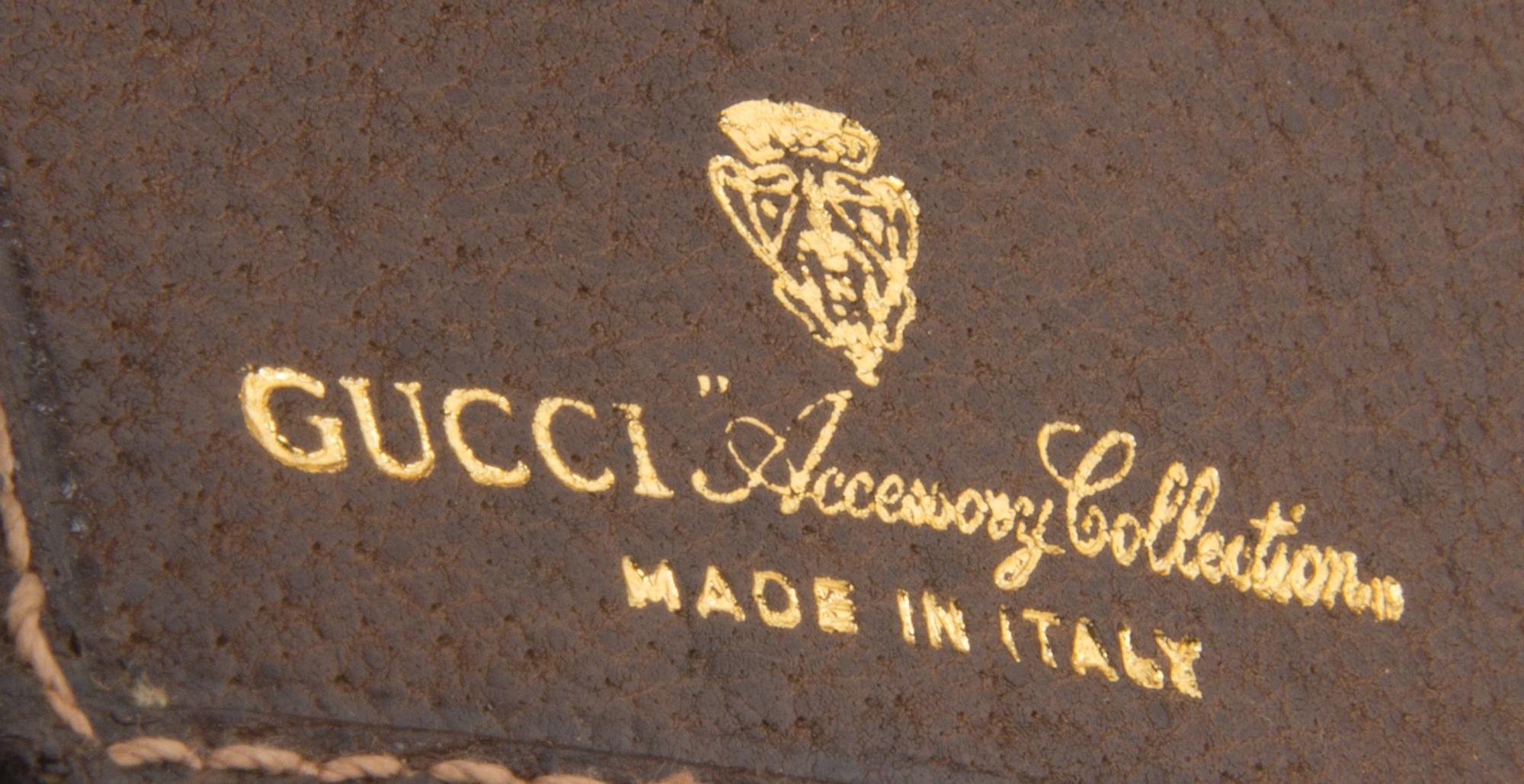 A Gucci Monogram Canvas Wallet, 7.5" x 4.5".