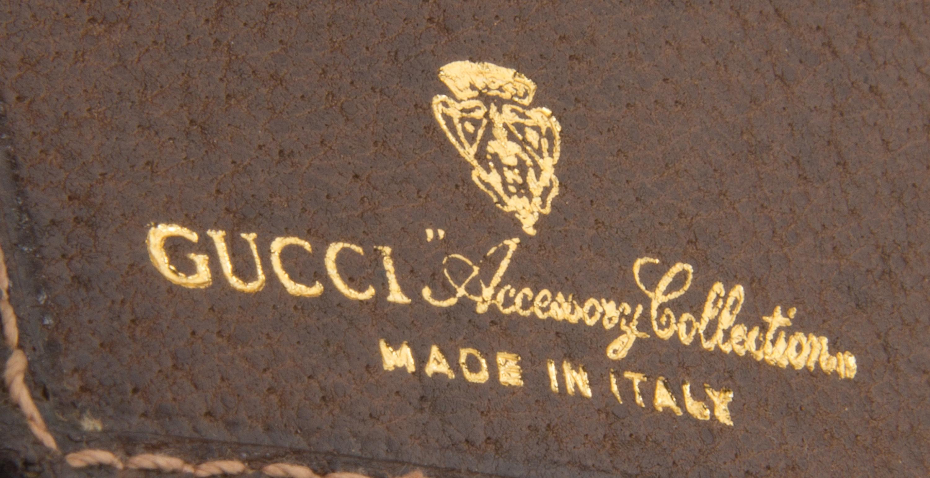 A Gucci Monogram Canvas Wallet, 7.5" x 4.5".