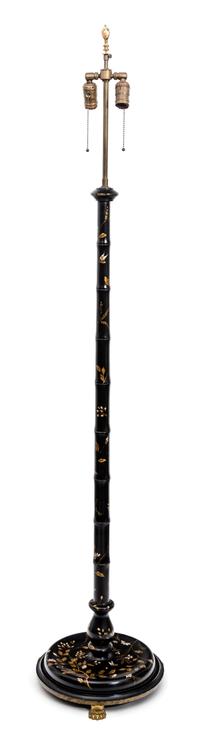 A Regency Style Faux Bamboo Black and Gilt-Japanned Standing Lamp Height 65 inches.