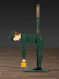 A Carved and Painted Wood Figural Post Office Scale