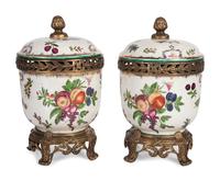 A Pair of United Wilson Gilt Metal Mounted Porcelain Urns