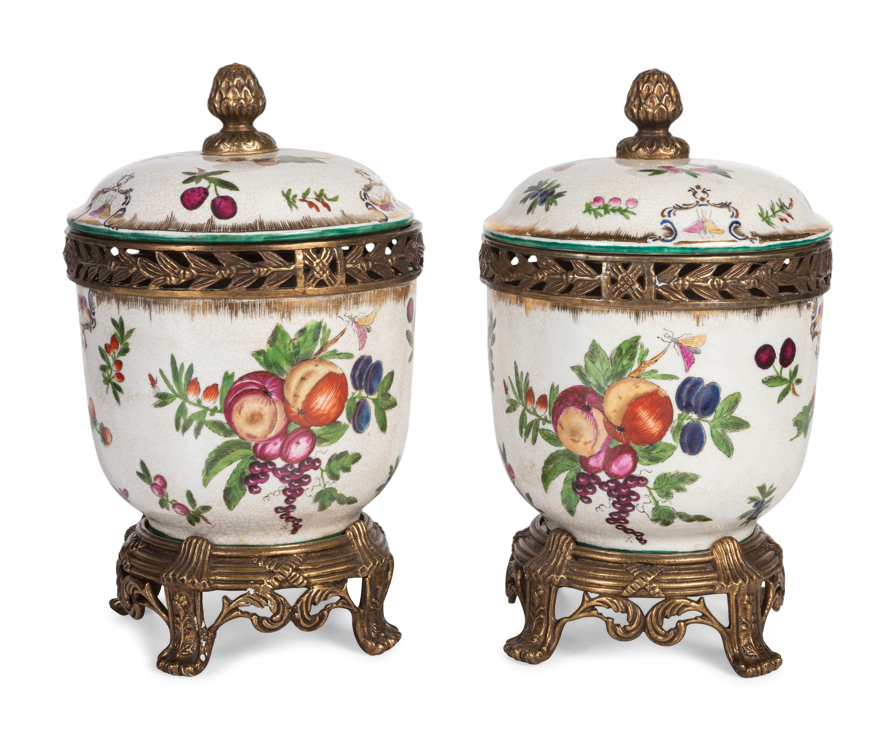 A Pair of United Wilson Gilt Metal Mounted Porcelain Urns