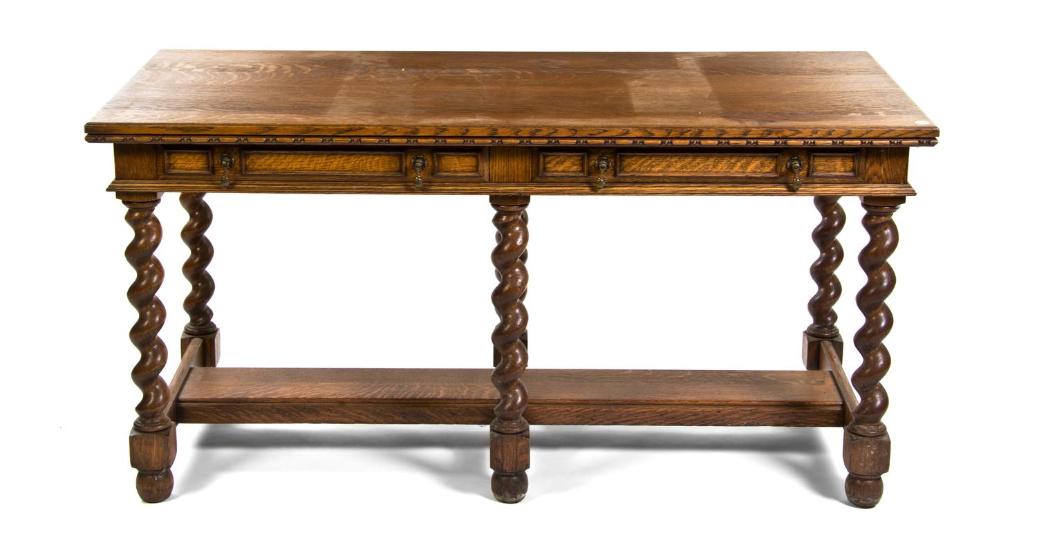 A Jacobean Revival Oak Library Table, Height 30 x width 60 x depth 28 inches.
