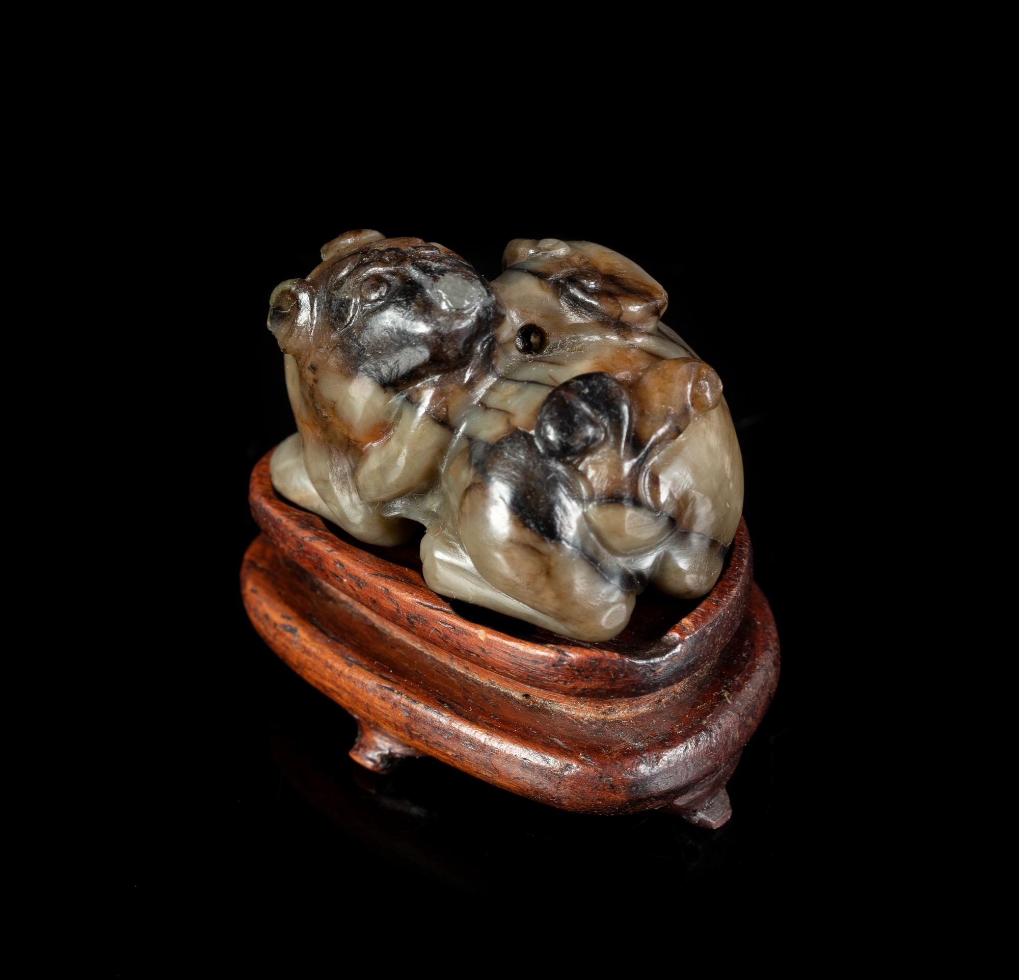 A Chinese Black and White Jade Figure of a Mythical Beast