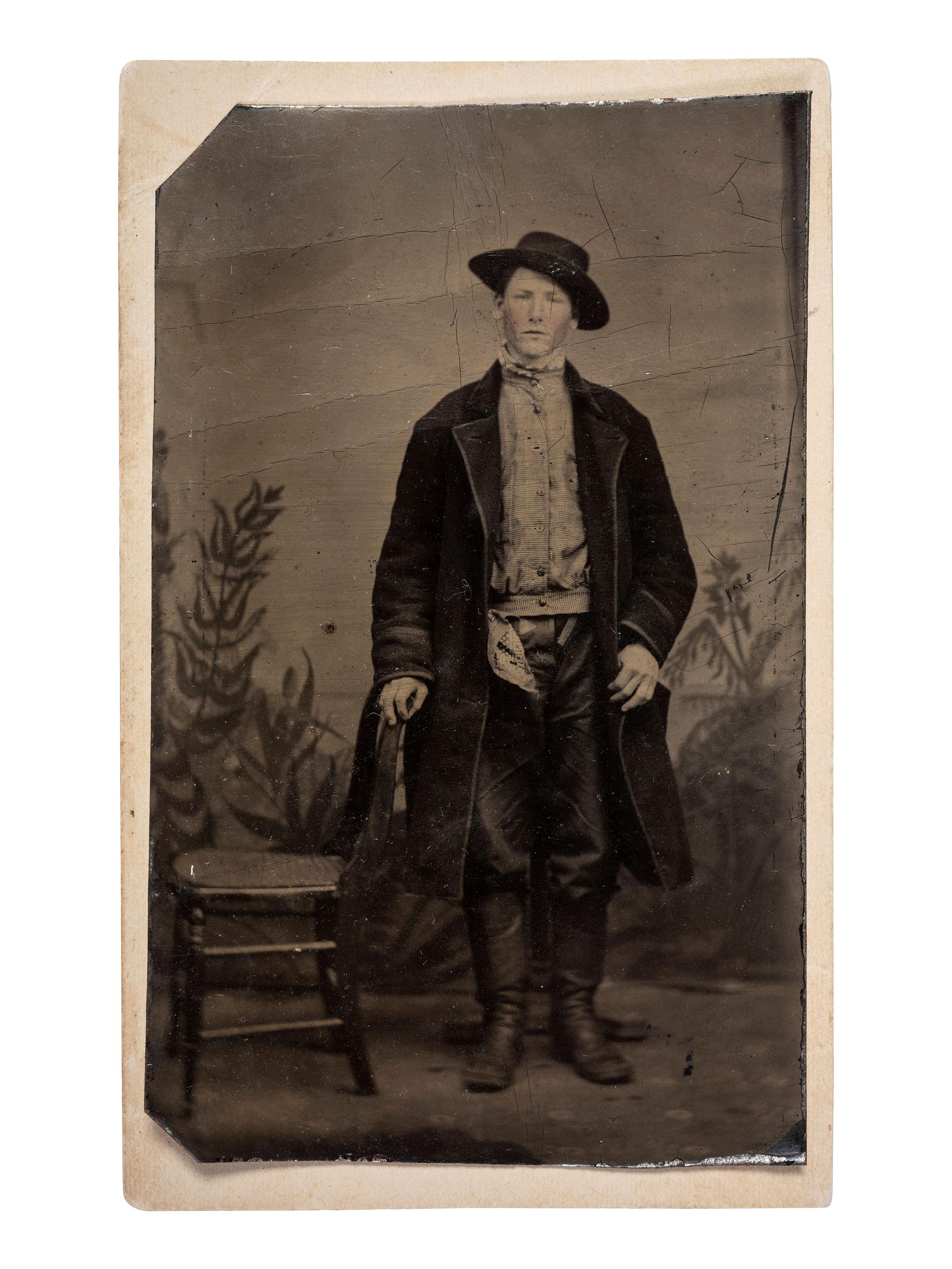 [EARLY PHOTOGRAPHY - TINTYPE]. A pair of tintypes featuring subjects in western dress, comprising: