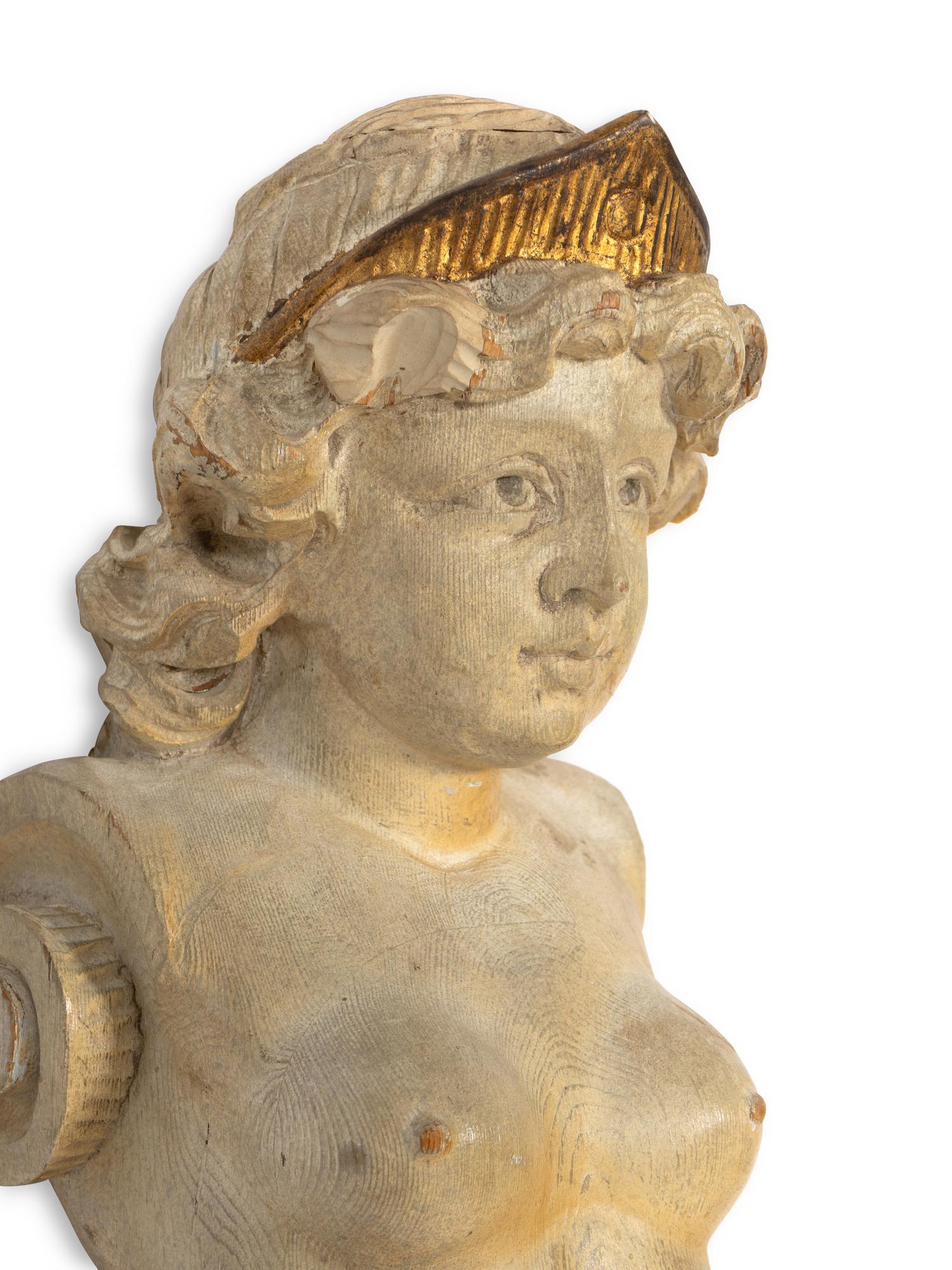 A Pair of Continental Carved Giltwood Caryatid Pilasters