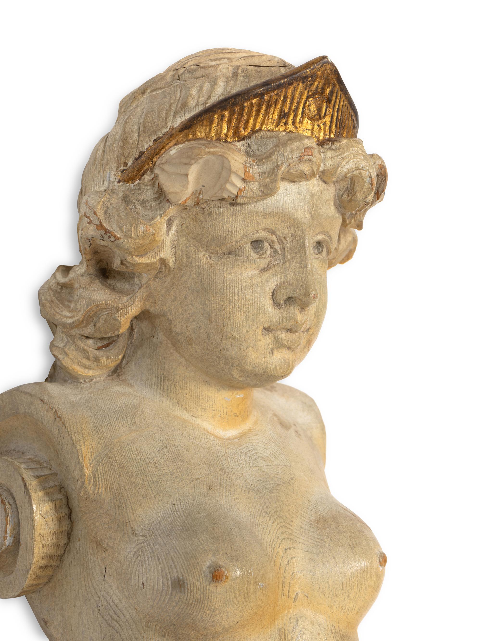 A Pair of Continental Carved Giltwood Caryatid Pilasters