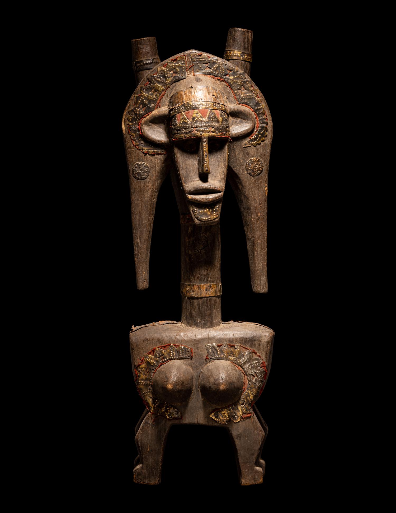 A Bamana Wood Marionette Figure with Eight Wood Puppet Heads
