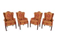 A Set of Seven George III Style Mahogany Wing Back Armchairs
