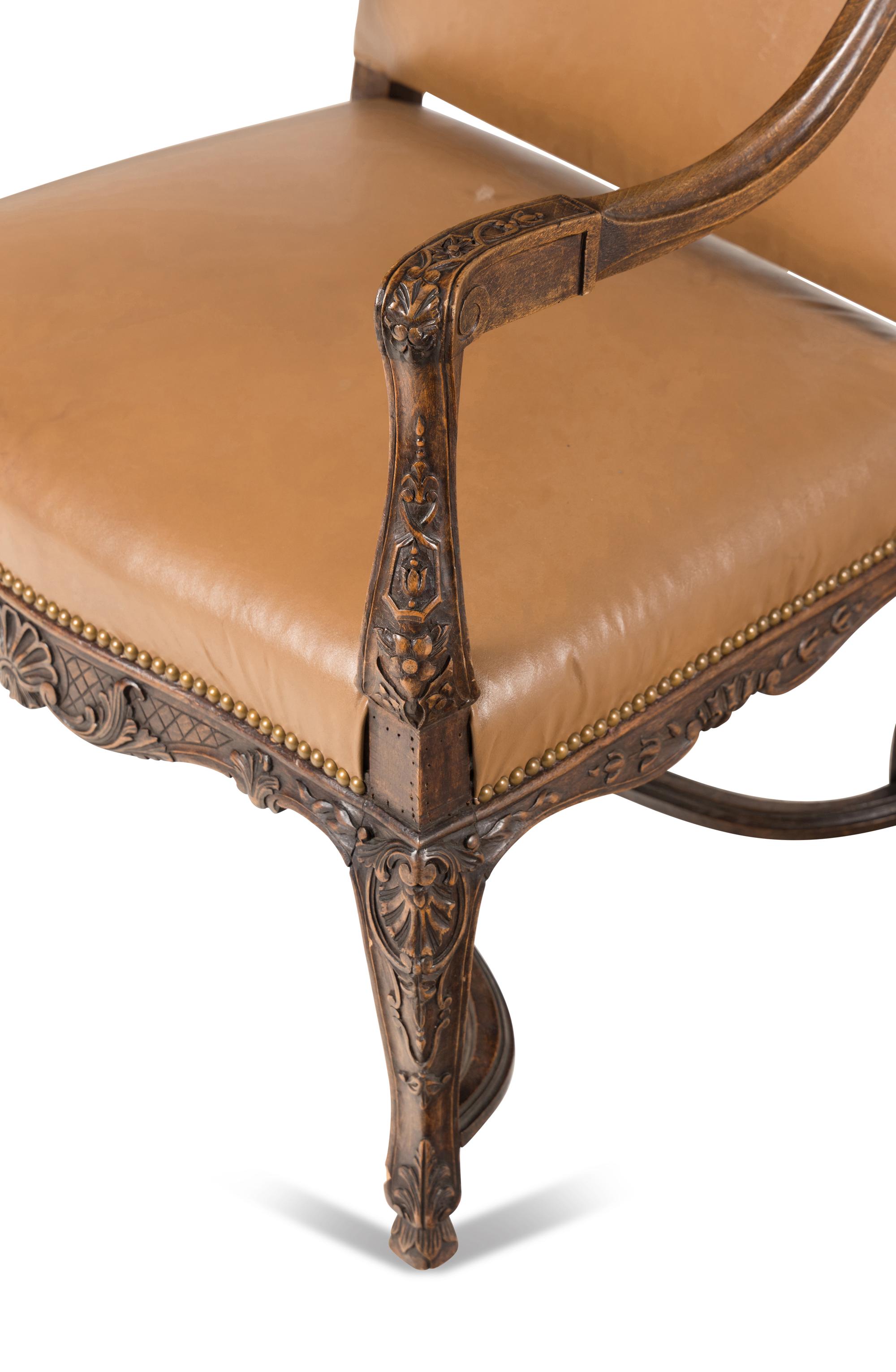 A Matched Pair of Régence Style Walnut Fauteuils
