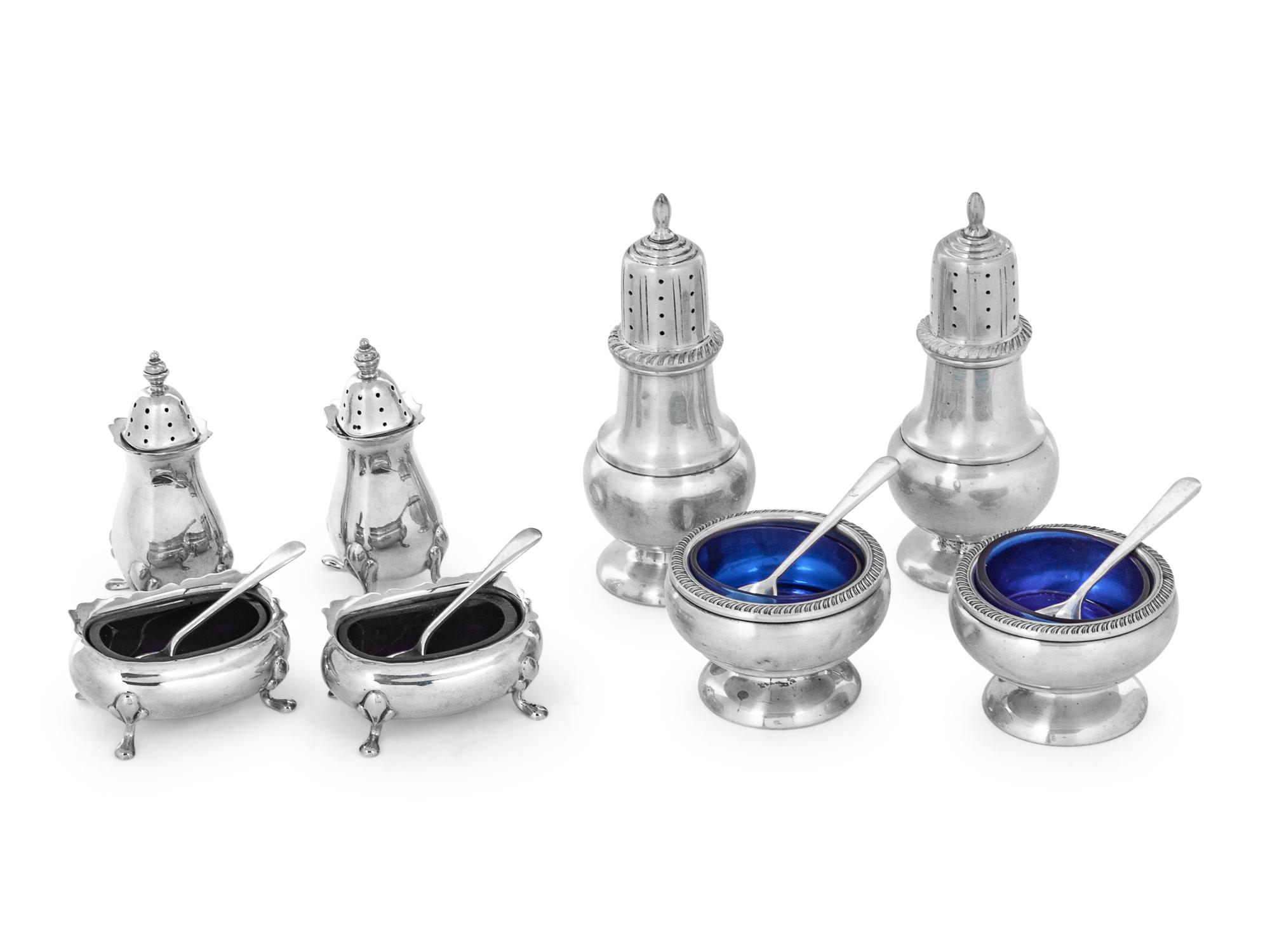 comprising four casters and four salt cellars with cobalt glass liners and spoons.