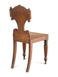 A Pair of William IV Carved Oak Hall Chairs